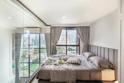 Luxurious bedroom with stunning city view and elegant decor