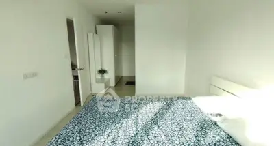 Bright and airy bedroom with modern minimalist decor and ample natural light.