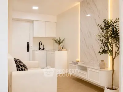 Elegant living room with modern decor and marble accent wall, featuring cozy seating and stylish lighting.