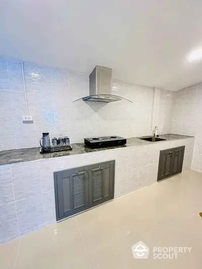 Modern kitchen with sleek cabinetry and stainless steel appliances