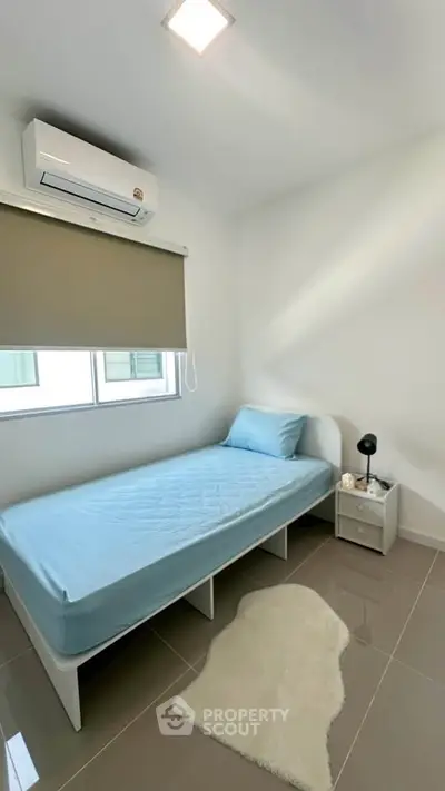 Cozy minimalist bedroom with single bed and modern decor