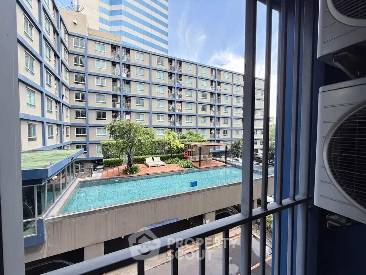 Modern apartment building with rooftop pool and city view