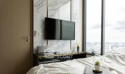 Modern bedroom with city view, featuring a wall-mounted TV and elegant decor.