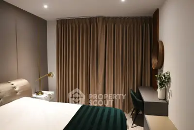 Modern bedroom with elegant decor, featuring a cozy bed, stylish desk, and ambient lighting.