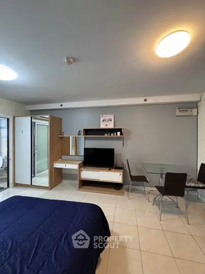 Modern studio apartment with sleek furniture and cozy ambiance