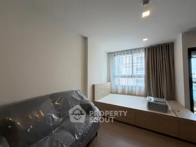 Modern bedroom with natural light and stylish furniture