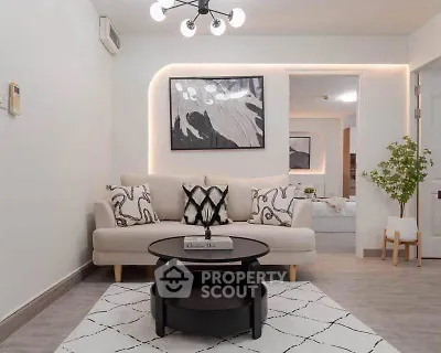 Modern living room with stylish decor and cozy seating area, perfect for relaxation and entertaining.