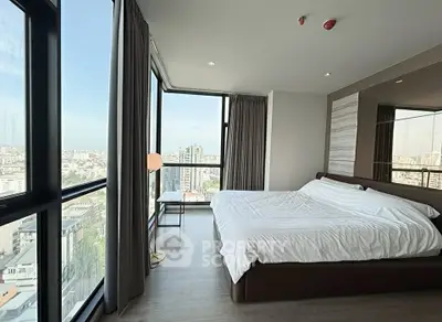 Luxurious bedroom with panoramic city view and modern decor