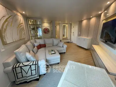 Luxurious living room with elegant decor and spacious seating area, perfect for relaxation and entertainment.