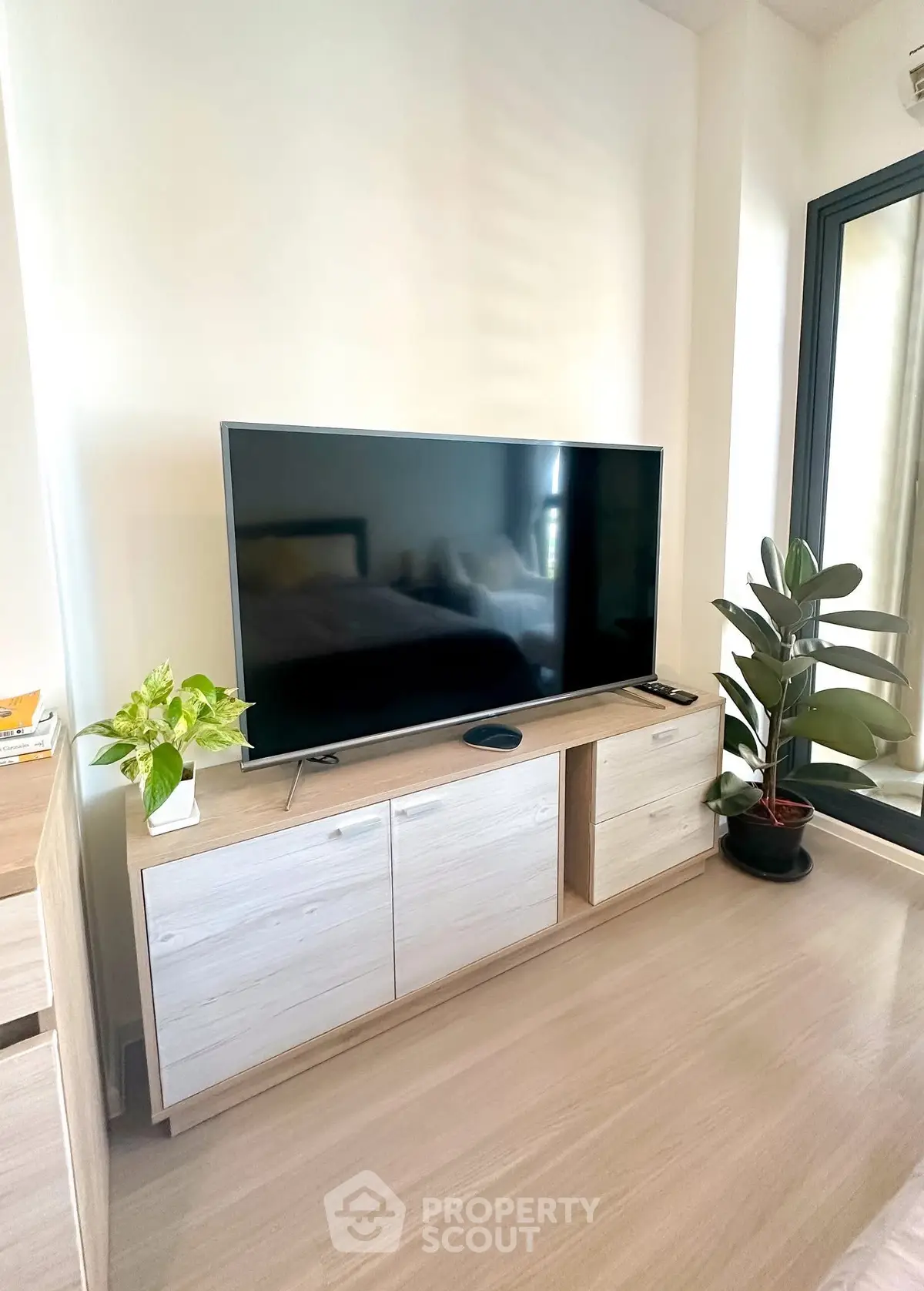 Modern living room with sleek TV setup and stylish decor