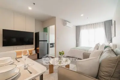 Modern studio apartment with open layout, featuring cozy living area, stylish kitchen, and inviting bedroom space.
