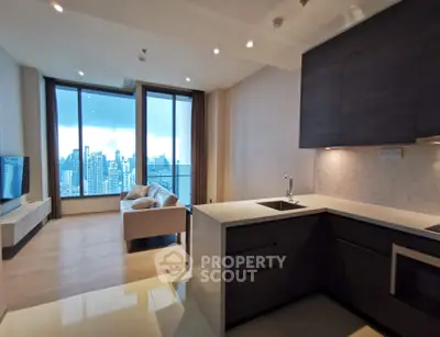 Modern open-layout kitchen and living room with stunning city view in luxury apartment.