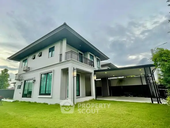 Modern two-story house with spacious lawn and sleek design