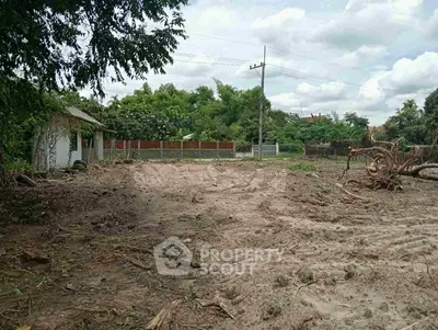 Spacious vacant land plot surrounded by lush greenery, ideal for development opportunities.