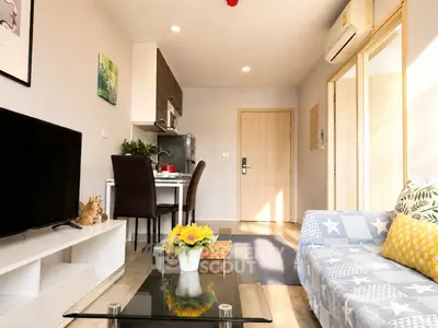 Bright and cozy living room with modern decor and open kitchen layout