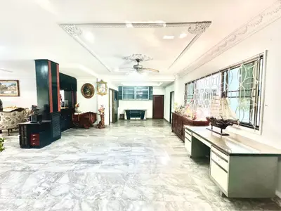 Spacious living room with elegant marble flooring and classic decor