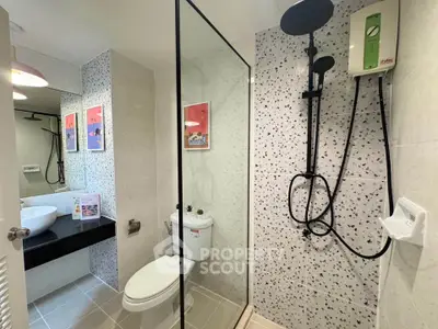 Modern bathroom with glass shower and stylish decor