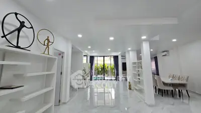 Spacious modern living room with elegant decor and dining area
