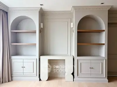 Elegant living room with built-in shelves and classic molding details