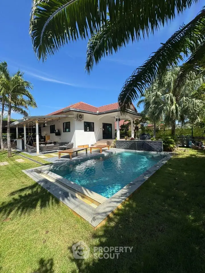 Luxurious villa with private pool and lush garden, perfect for relaxation and entertainment.