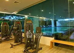Luxurious gym with pool view in modern real estate property