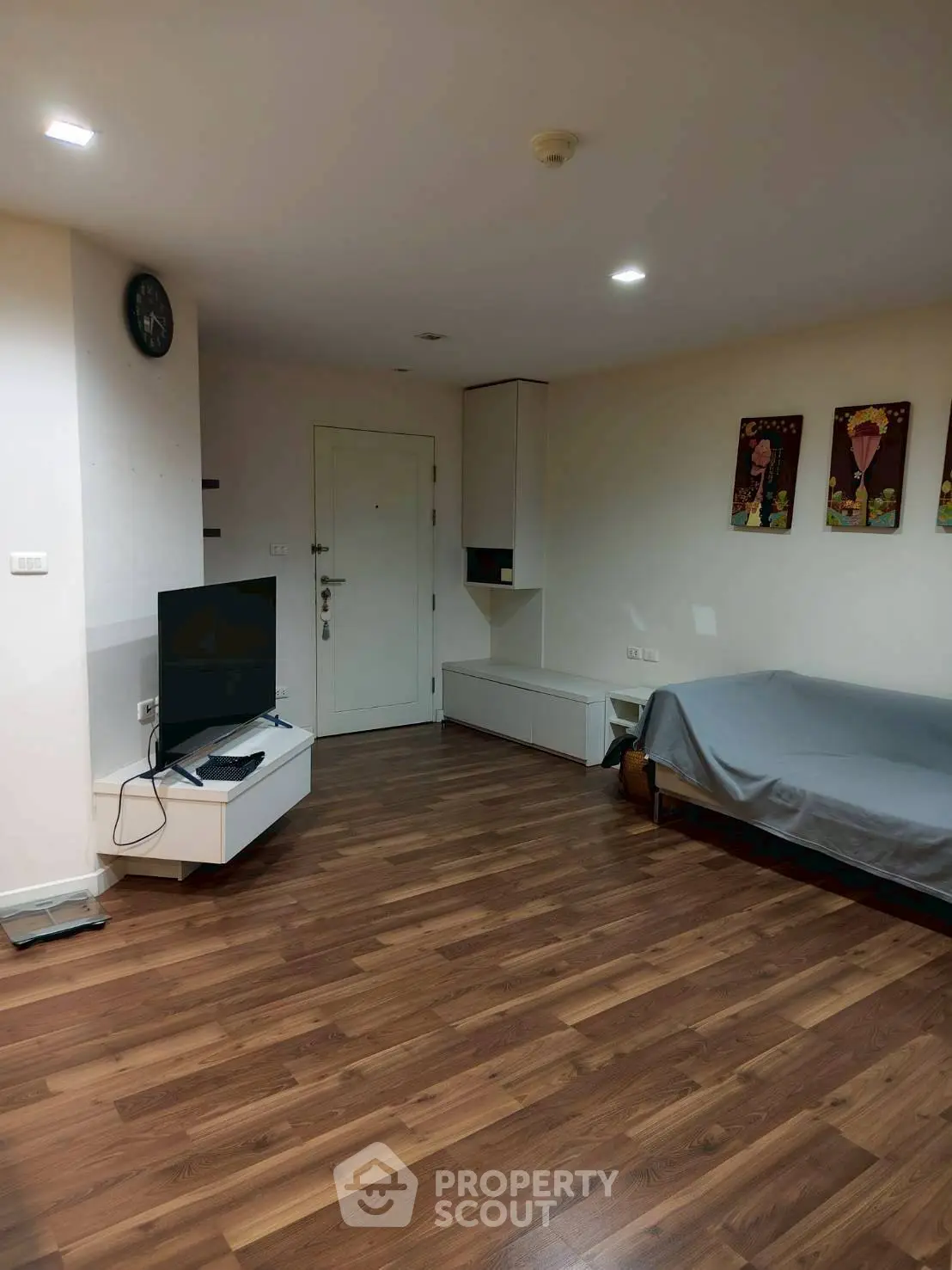 Spacious living room with wooden flooring and modern decor