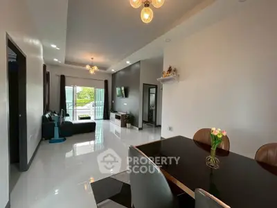 Spacious modern living and dining area with elegant decor and ample natural light.