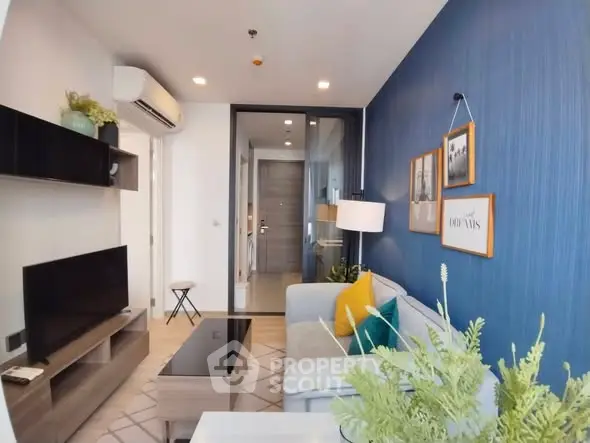 Modern living room with stylish decor and blue accent wall