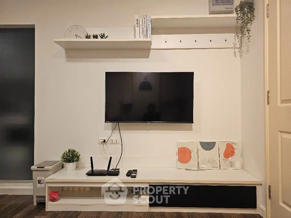 Modern living room with wall-mounted TV and stylish decor