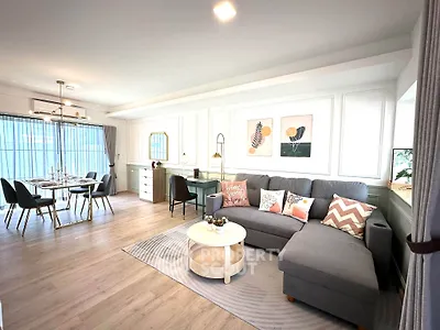 Spacious modern living room with stylish decor and dining area, perfect for entertaining.