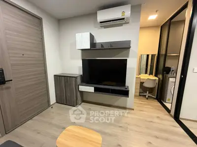 Modern apartment interior with wall-mounted TV and air conditioning