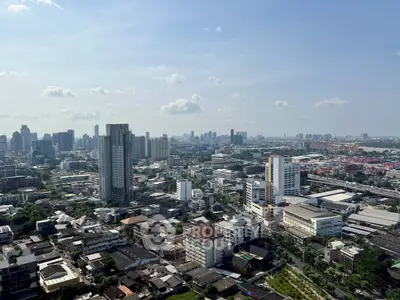 Stunning cityscape view showcasing urban skyline and high-rise buildings under a clear blue sky.
