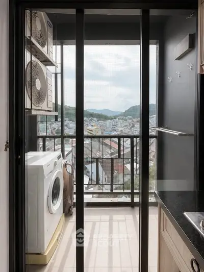 Modern apartment balcony with washing machine and scenic city view