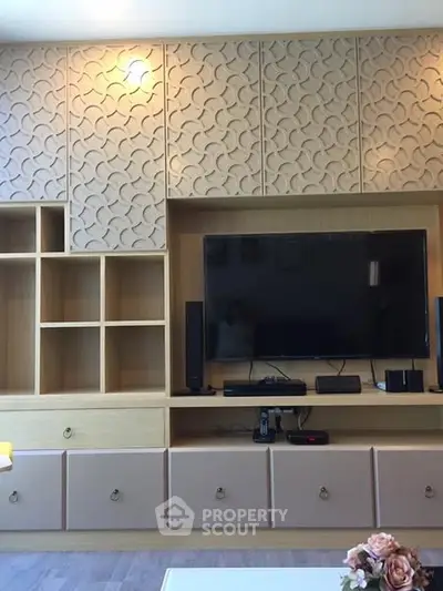 Modern living room with stylish TV unit and decorative wall panels