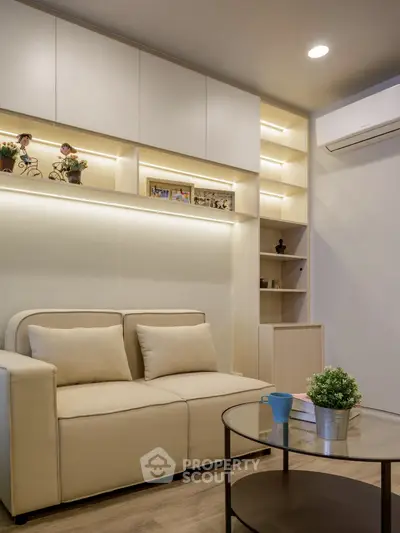 Modern living room with cozy beige sofa and stylish shelving