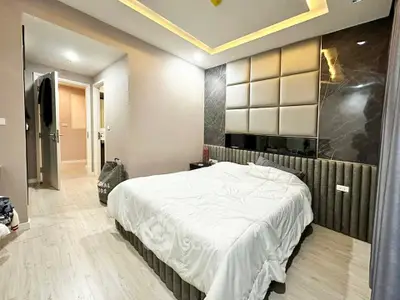 Modern bedroom with stylish decor and ambient lighting