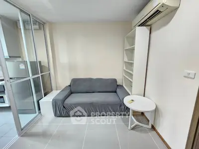 Cozy living room with modern sofa and air conditioning in a compact apartment