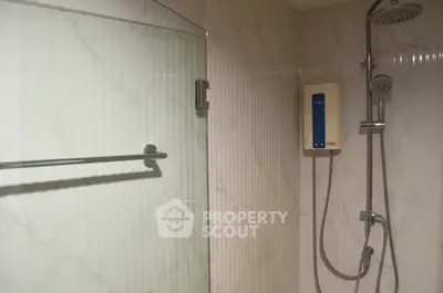 Modern bathroom with glass shower and water heater