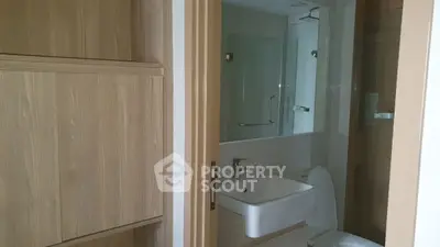 Modern bathroom with sleek fixtures and wooden accents
