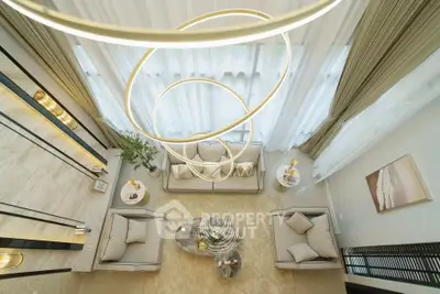Luxurious modern living room with elegant lighting and plush seating, perfect for relaxation and entertaining.