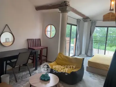 Charming living area with unique architectural features and cozy seating.