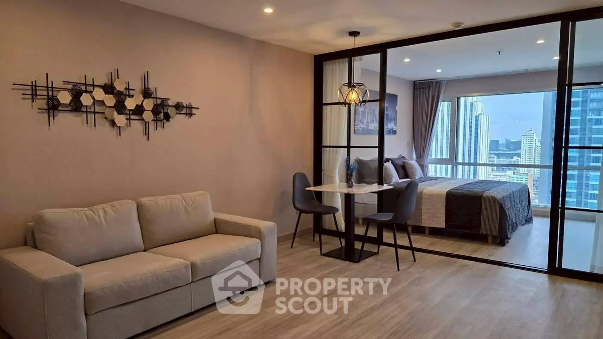 Modern open-plan living room with city view and stylish decor