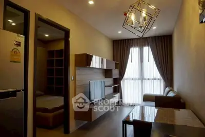 Modern living room with stylish lighting and cozy furniture in a contemporary apartment.