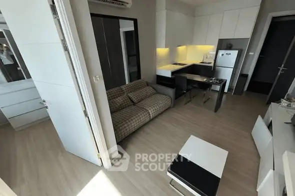 Modern compact living room with open kitchen and stylish decor