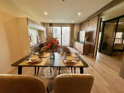 Elegant dining area in modern apartment with city view, featuring stylish decor and open layout.