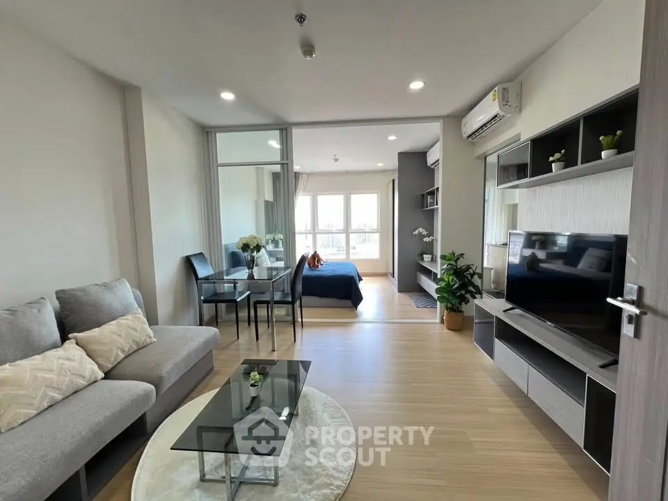 Modern open-plan living room with cozy seating and stylish decor