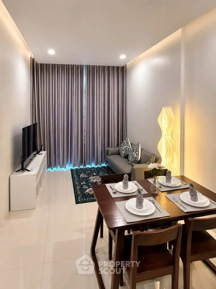 Modern living room with elegant dining area and stylish decor