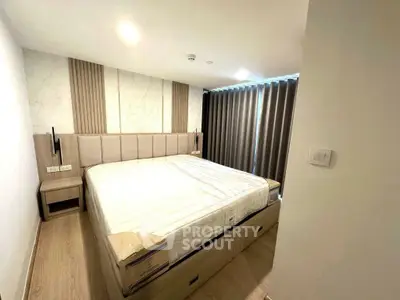Modern bedroom with stylish decor and ample storage space