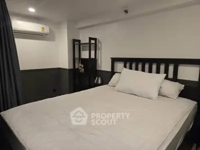 Cozy bedroom with modern decor and air conditioning unit