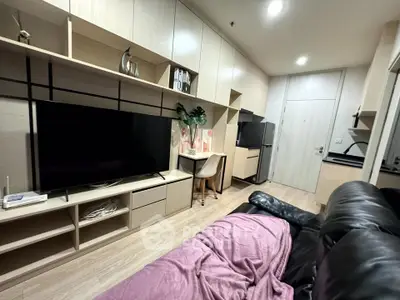 Modern living room with sleek storage and cozy seating